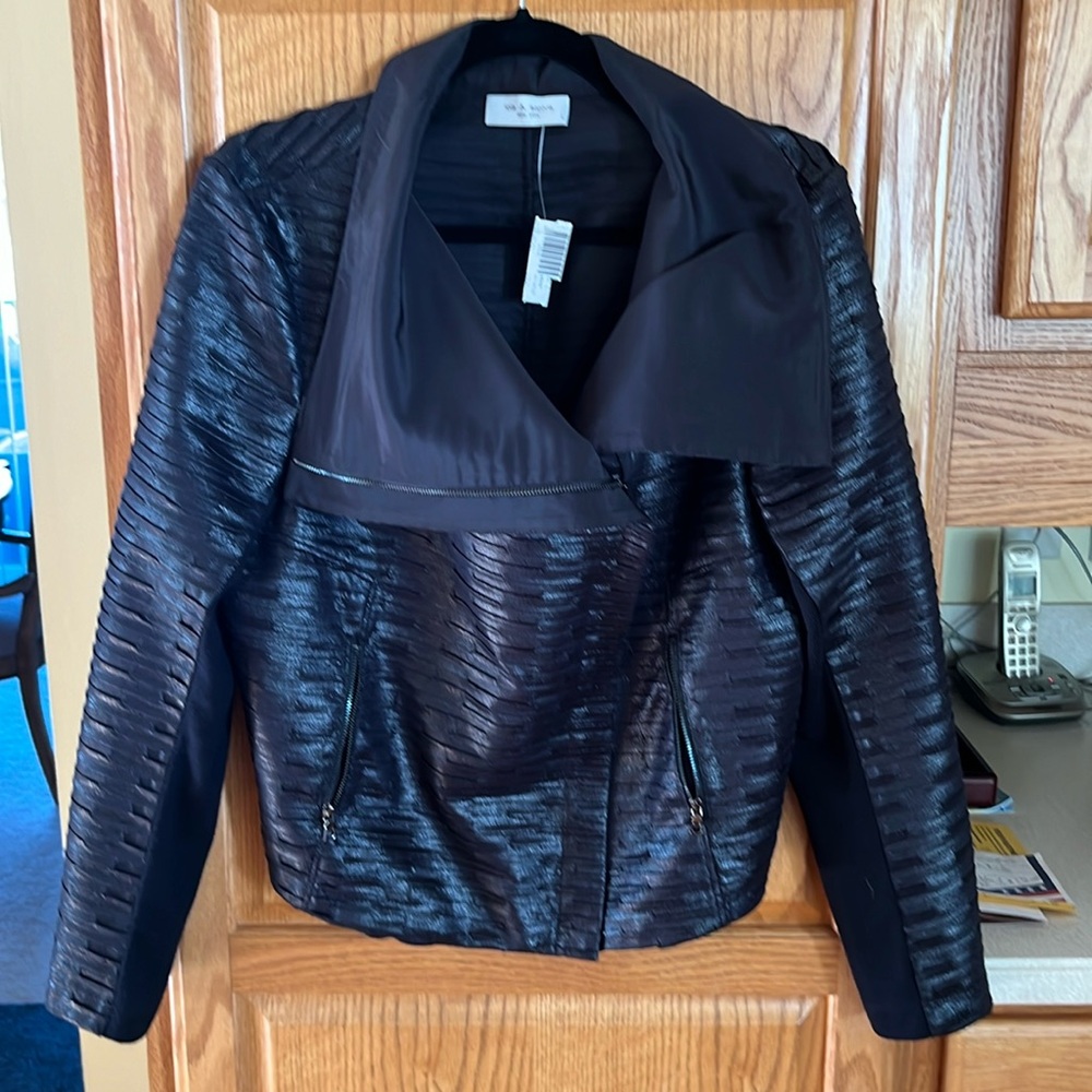Lightweight women’s jacket. Faux leather material. Size large.